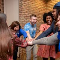 committee with hands in